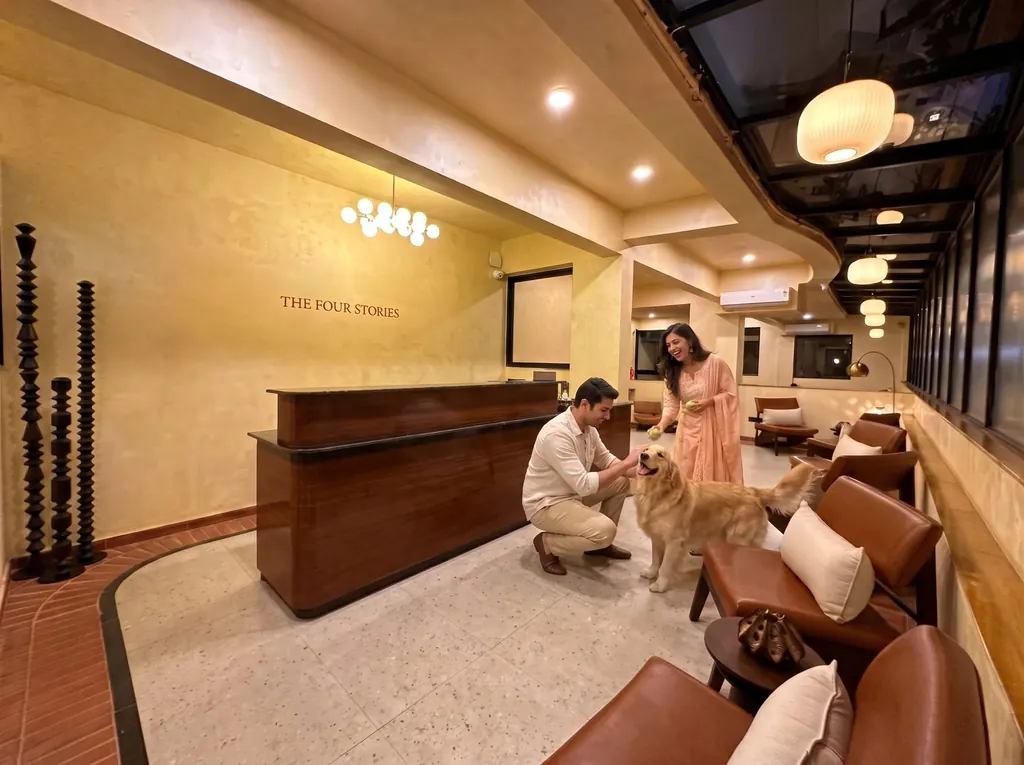 Guests with their dog at the reception desk of a pet-friendly hotel in Udaipur
