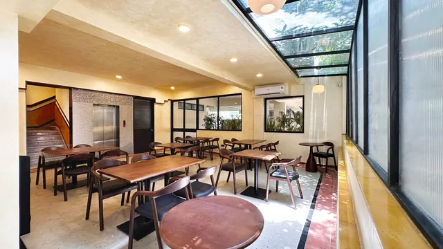 Skylit common area with lounge seating